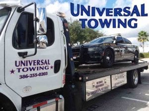 Florida Highway Patrol Challenger being towed by Towing Company