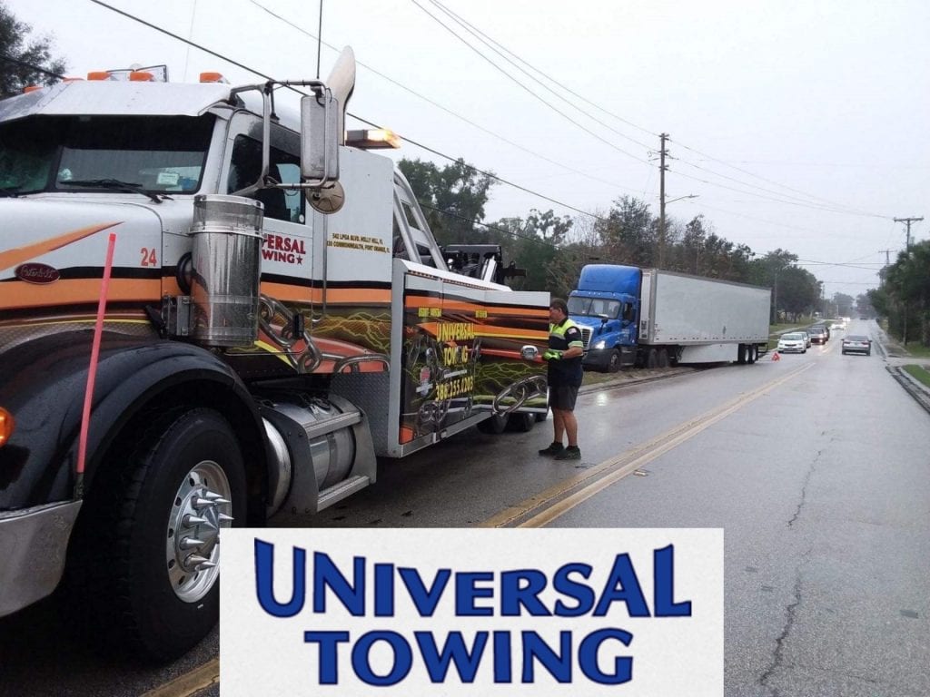 the universal towing heavy towing holly hill team hauling a semi out of sand