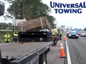 Heavy Truck Towing of Dumpster Truck on I-95