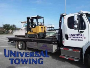 Forklift Moving in Action by Universal Towing & Heavy Duty Semi Truck Wrecker