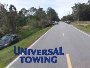 New Smyrna Beach Towing Services in action before sedan is winched out