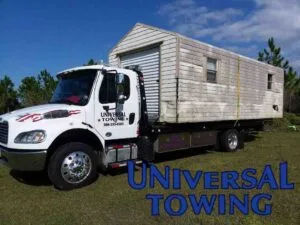 Tow truck service using flatbed with shed