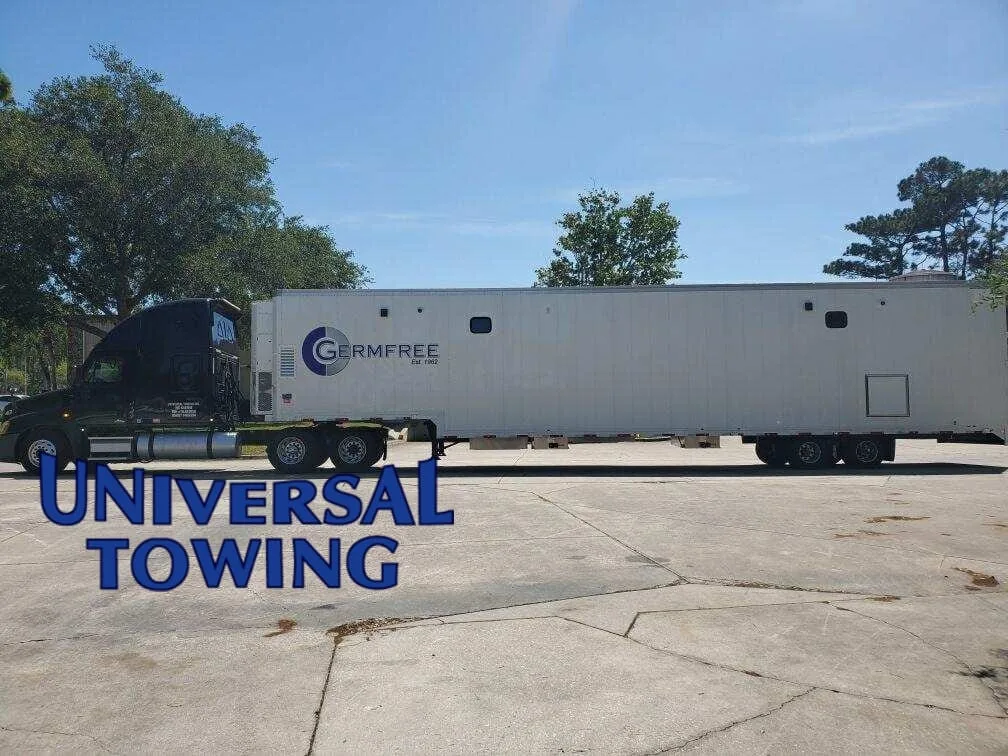 Our wrecker service pulling the germ free trailer